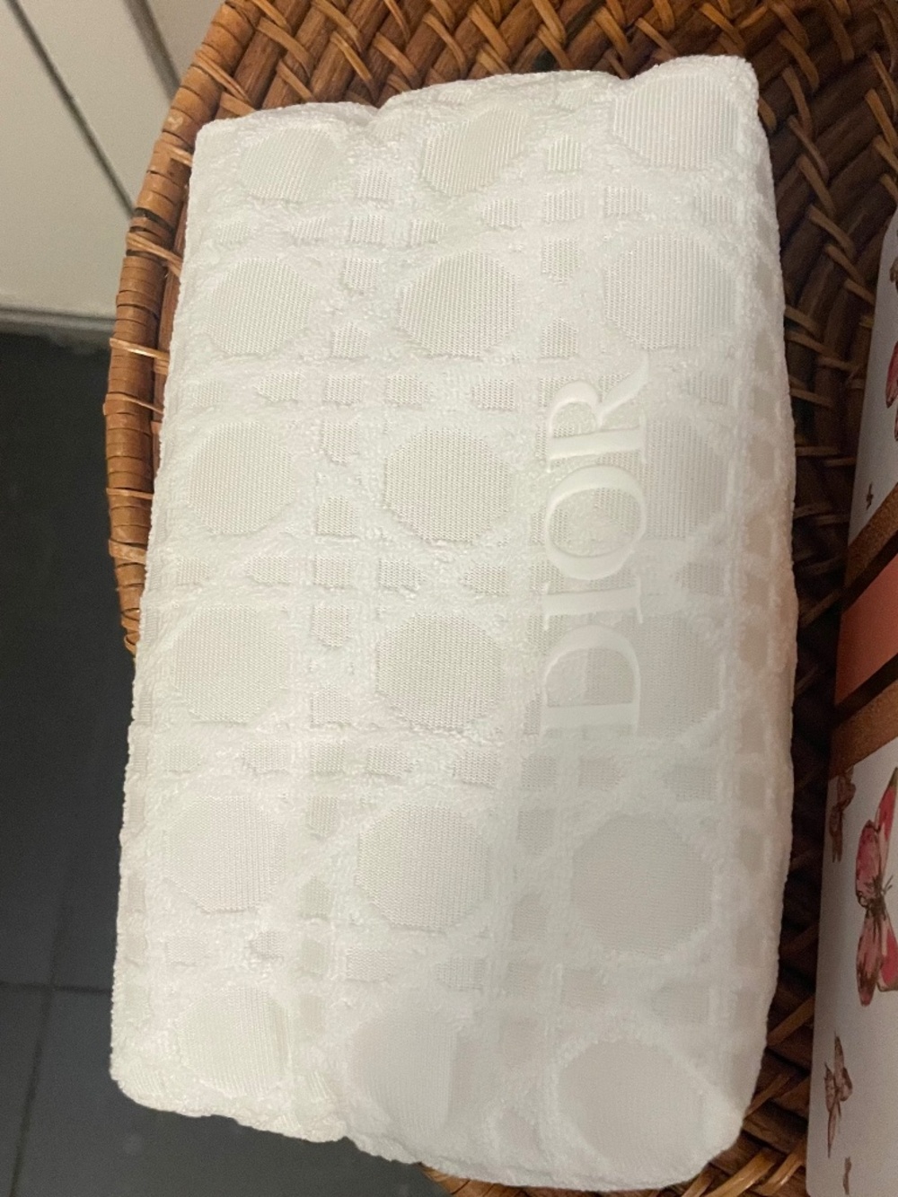 White Dior cosmetic pouch with box and Dior branded packing materials